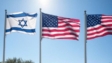 US and Israeli flags waving together at a diplomatic summit, symbolizing their strong alliance.